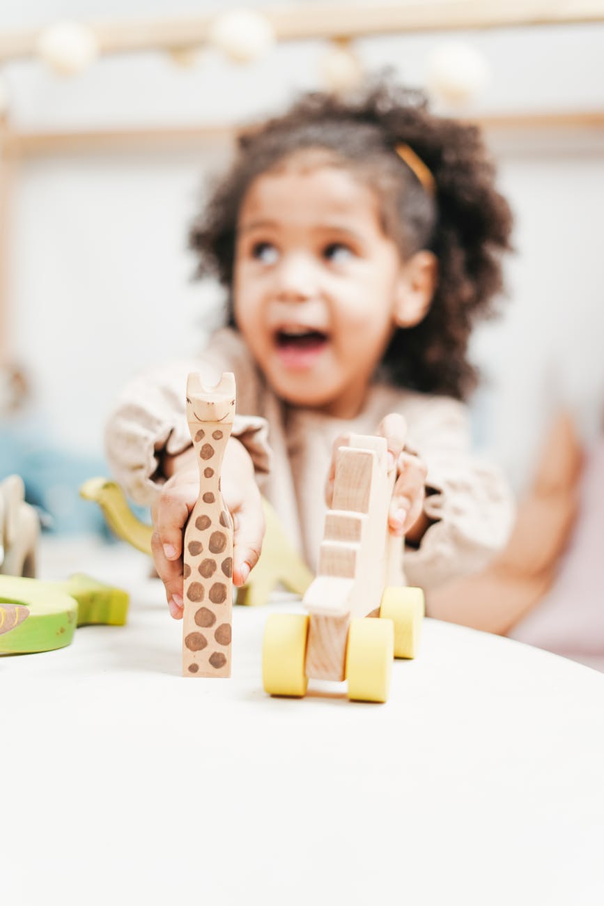 a girl playing with her toys