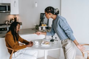 african american couple having conflict at kitchen